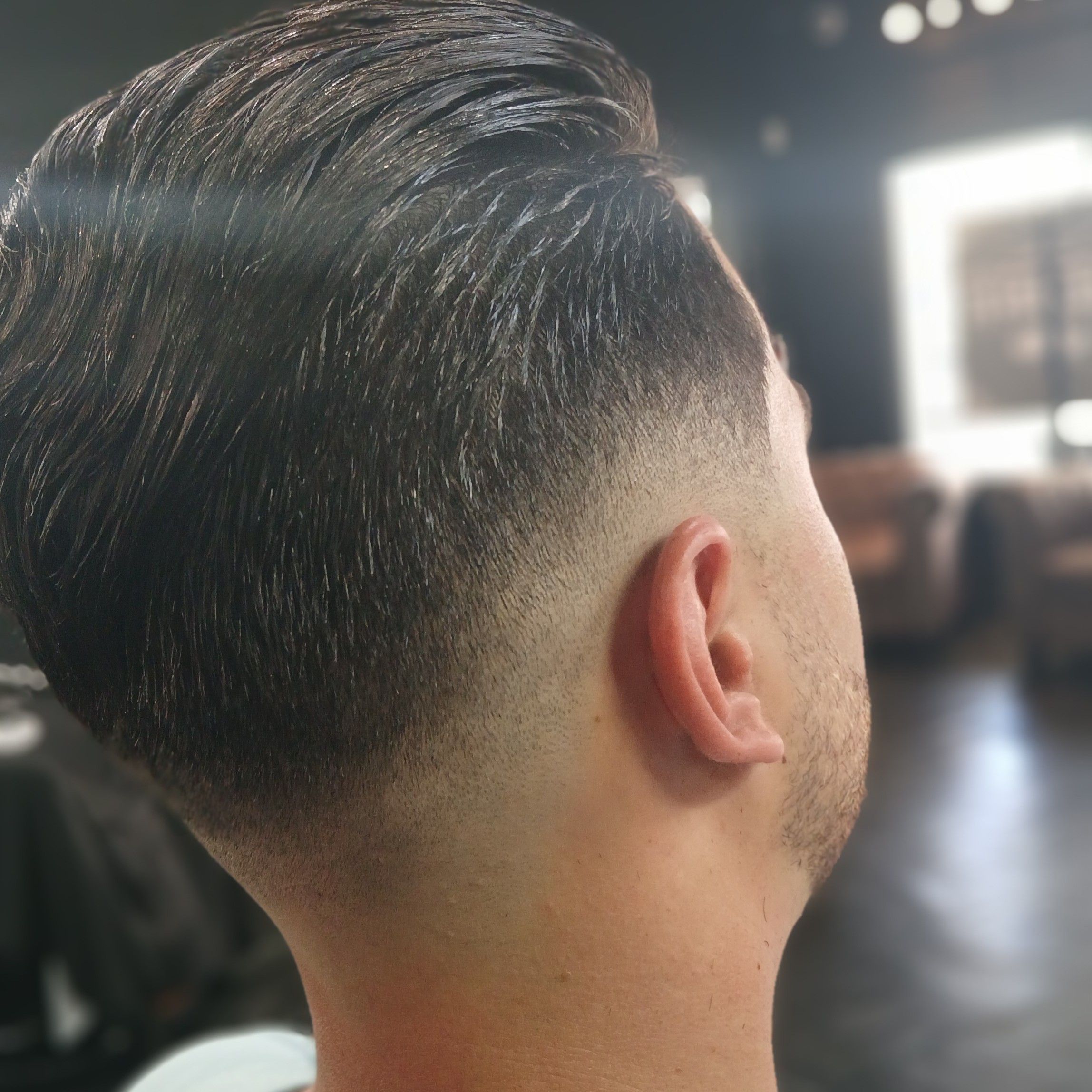 Skin fade with slick back finish